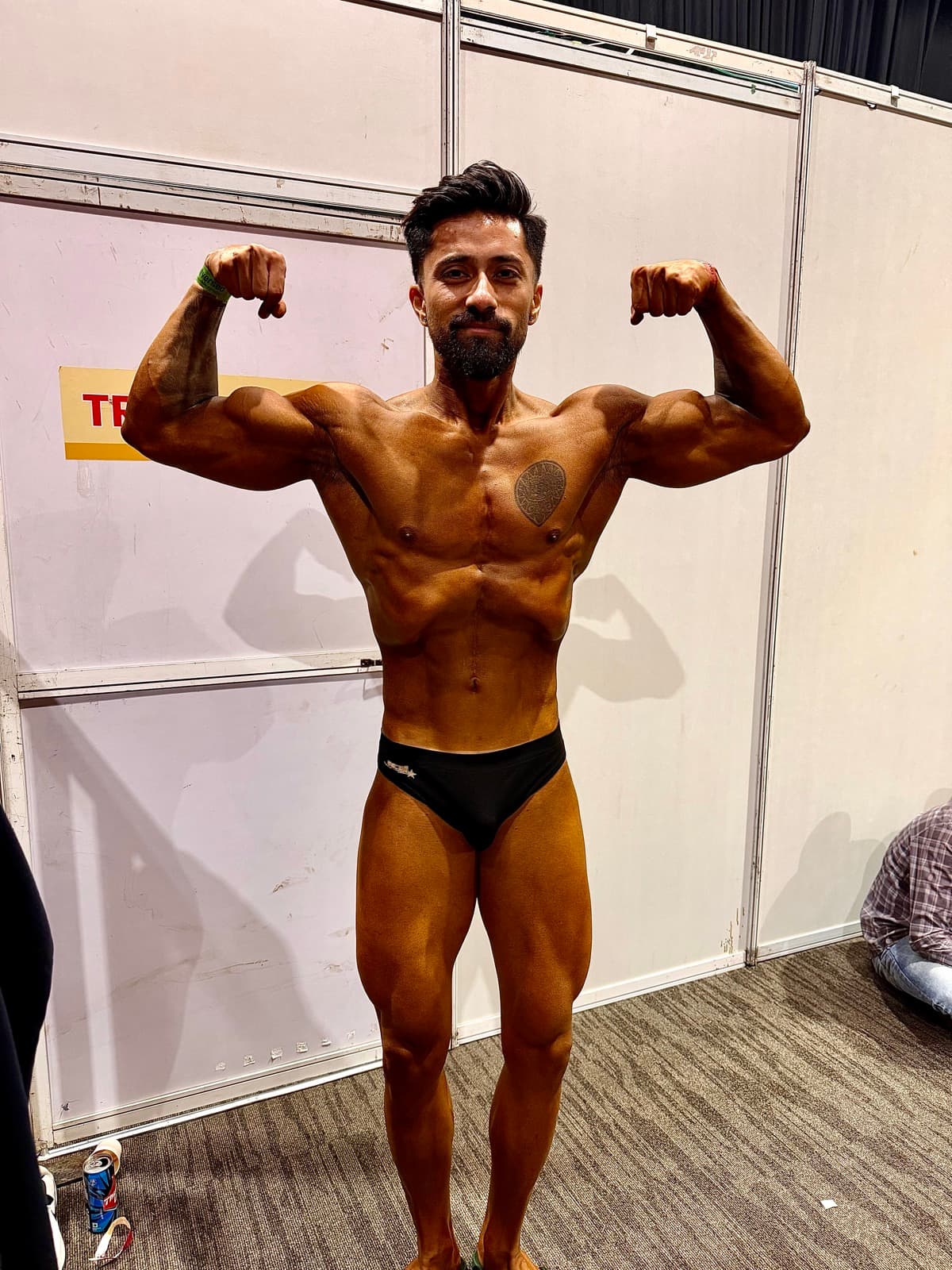 Siddharth on stage at a bodybuilding show